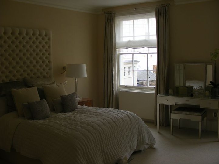 Completed bedroom with soft neutral wall finish