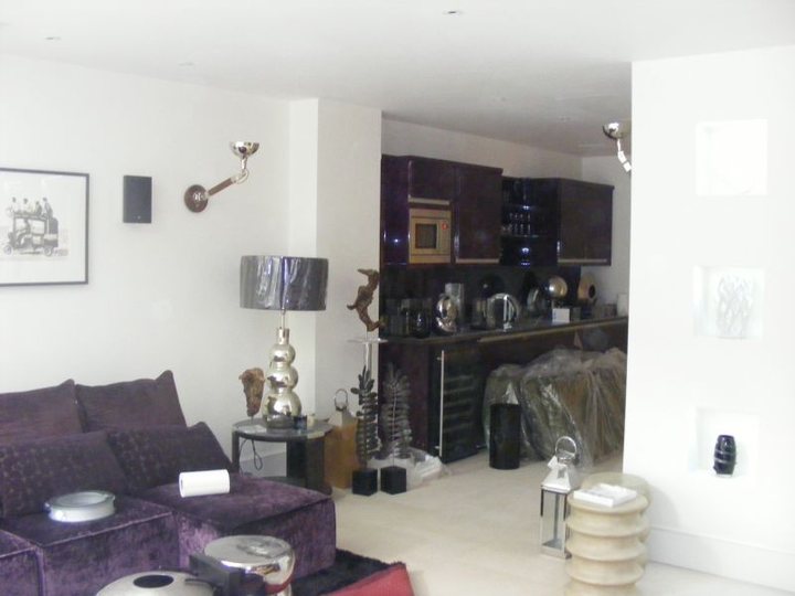 Completed open-plan interior with smooth light wall finishes