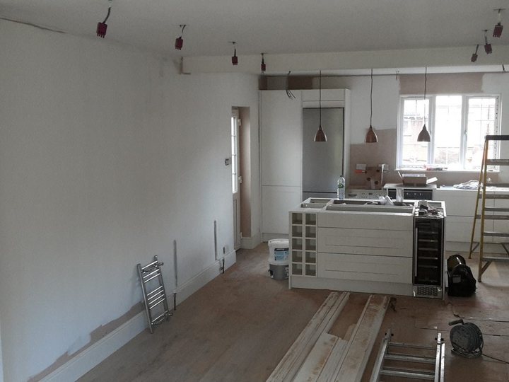 Large interior being carefully prepared and decorated