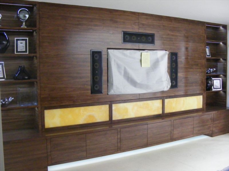 Living room decorated around a dark timber feature wall by Decor-Plast, painter and decorator serving Croydon